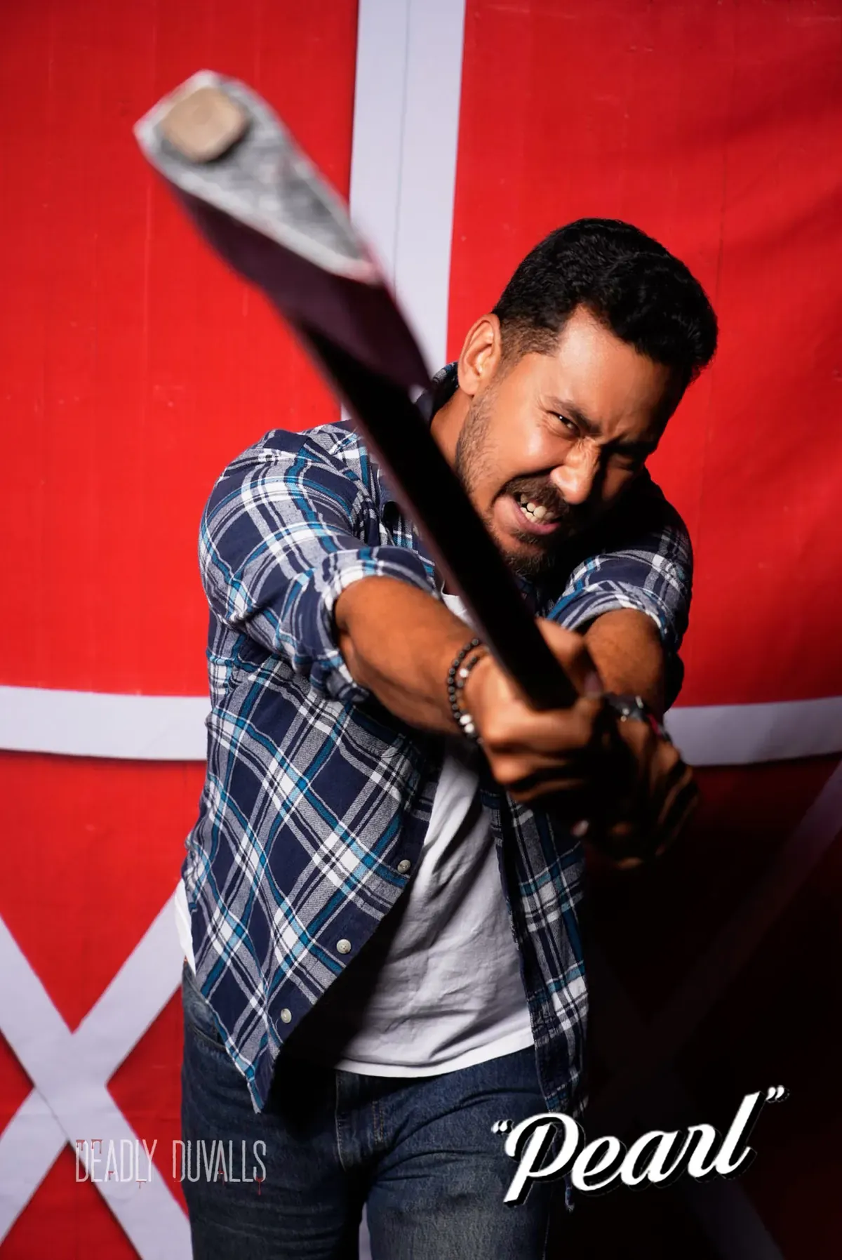 Guest in a plaid shirt swinging a prop weapon toward the camera, snarling — action portrait from the Deadly Duvalls Pearl photo booth